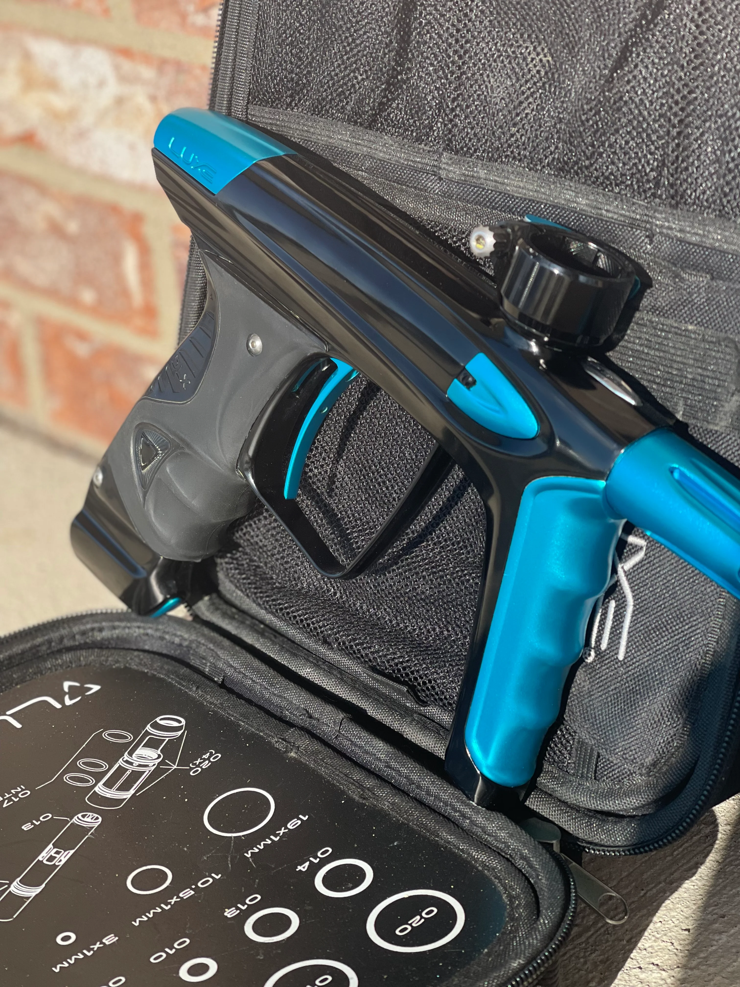 Used DLX Luxe Ice Paintball Gun - Polished Black / Dust Teal - Image 2