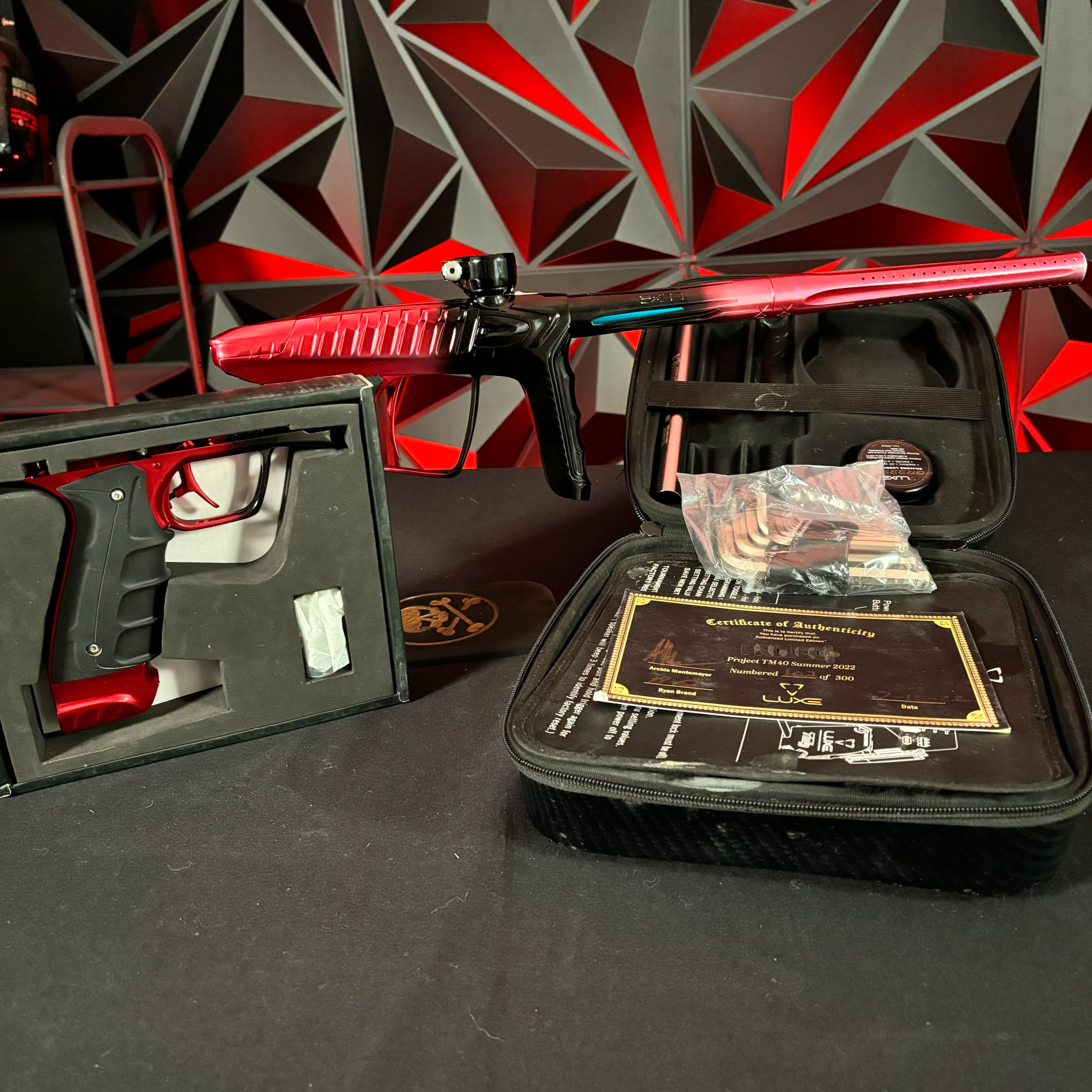 Used DLX Luxe "Project" TM40 Paintball Gun - Red/Black Fade w/Matching Mech Frame