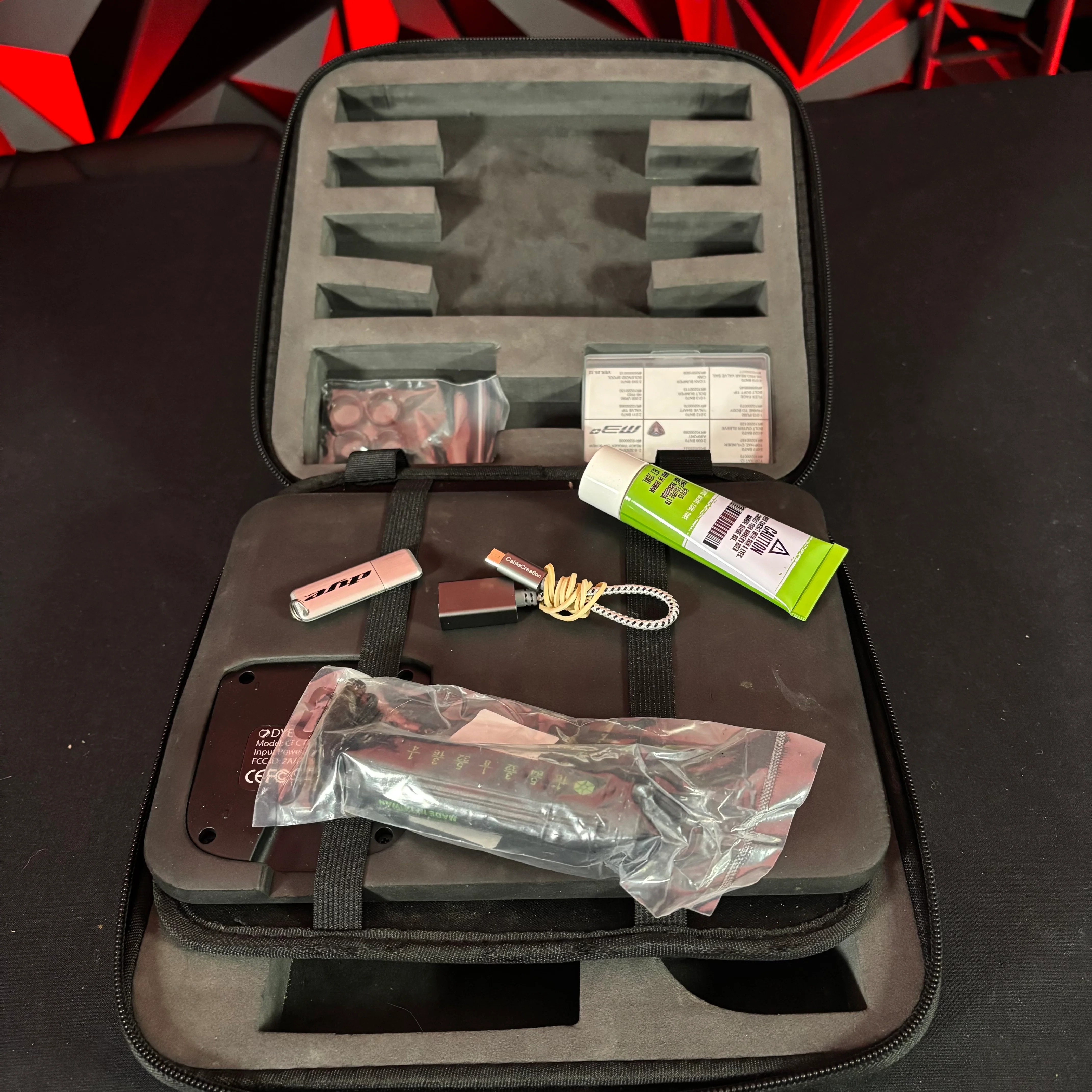 Used Dye M3+ Paintball Gun - Lights Out w/MOSAir Wireless Charging Pad & White/Grey Grip Kit - Image 8