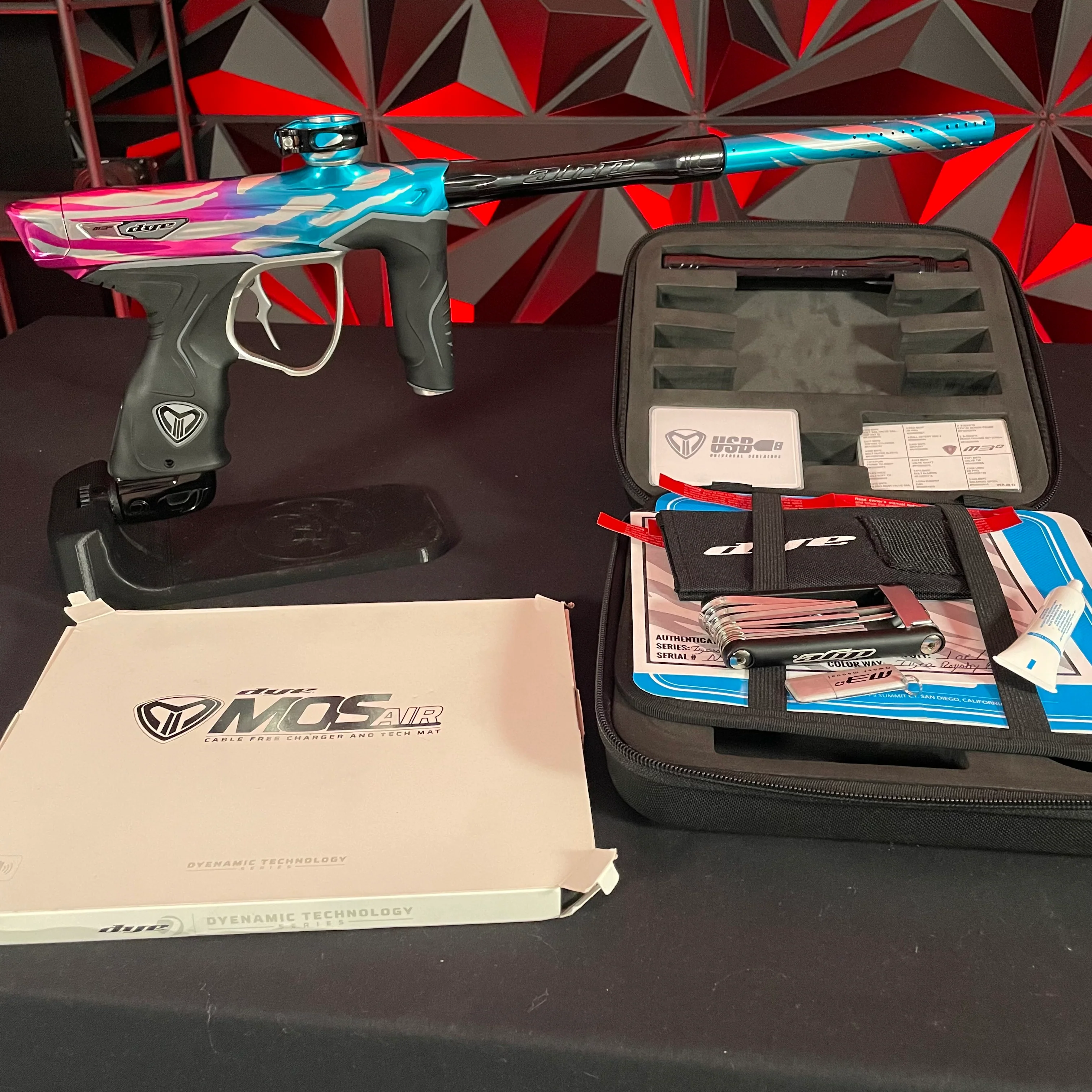 Used Dye M3+ Paintball Gun - Tiger Royalty (Pink & Cyan) w/ MOSAir Charging Pad