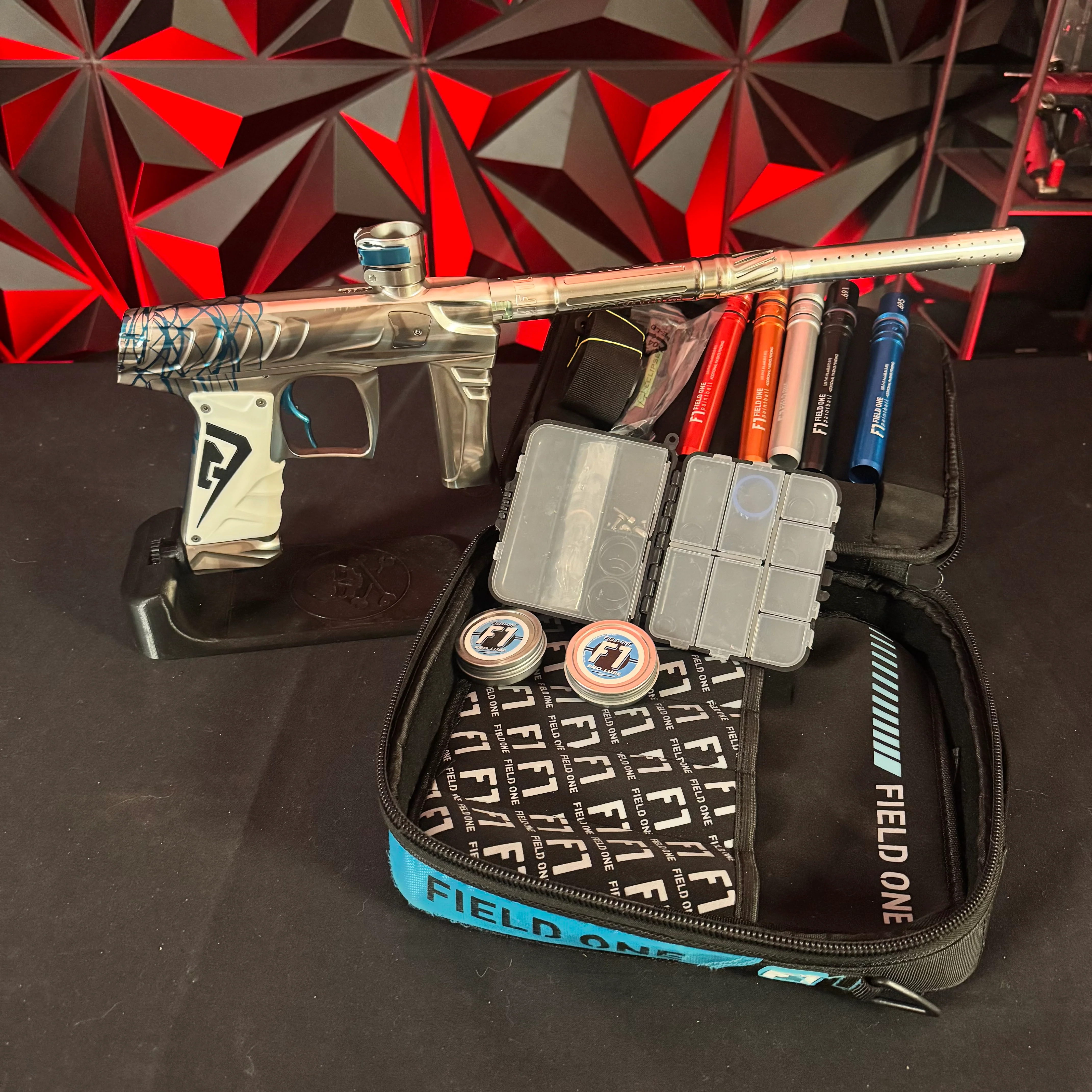 Used Field One Force Paintball Gun - Polished Silver w/Blue Splash & 6 Acculock Inserts