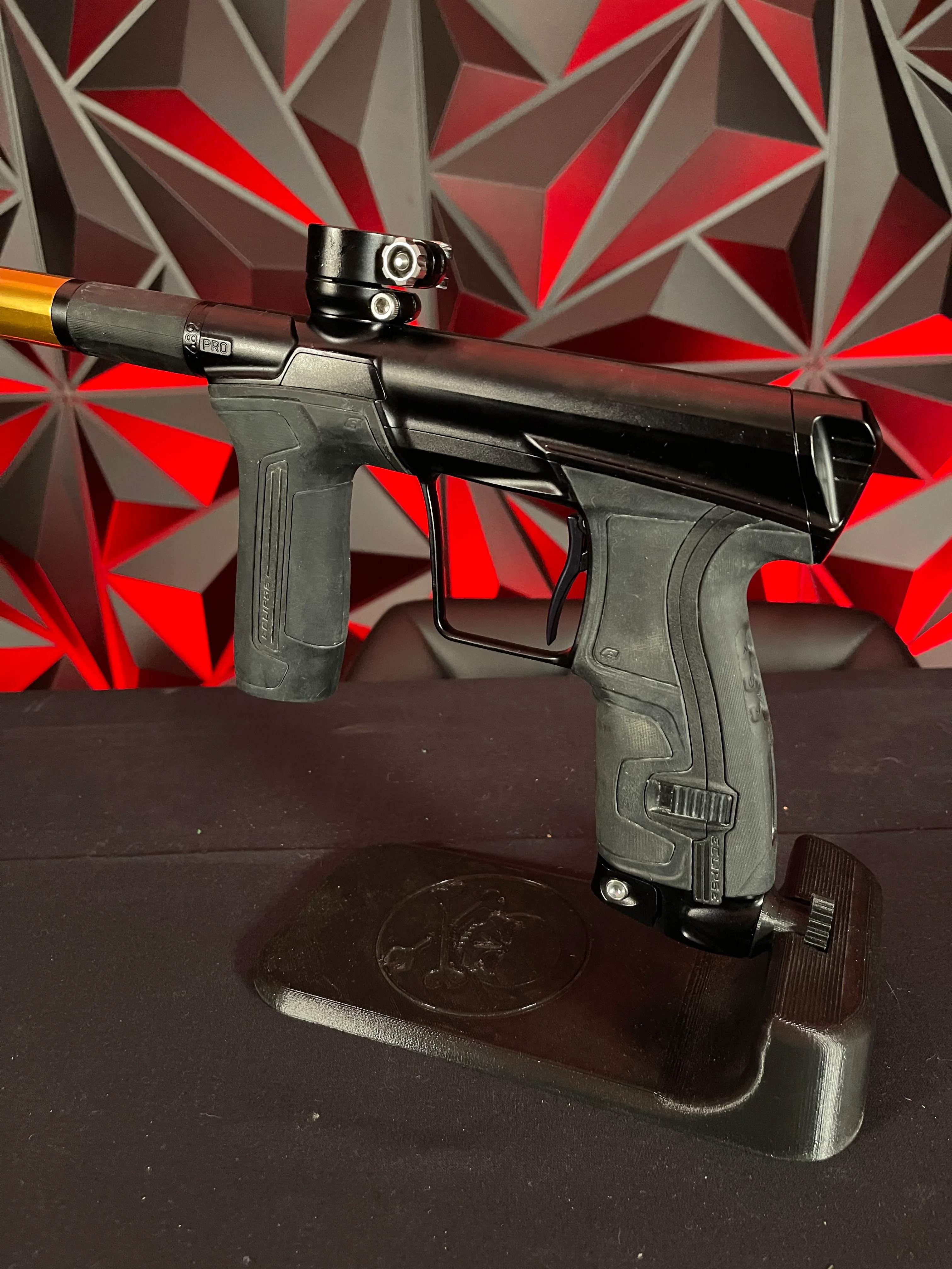 Used Planet Eclipse CS2 Pro Paintball Gun - Black w/ Gold Infamous FL Tip, 2 FL Backs, and Spare Black/White Grip Kit - Image 2