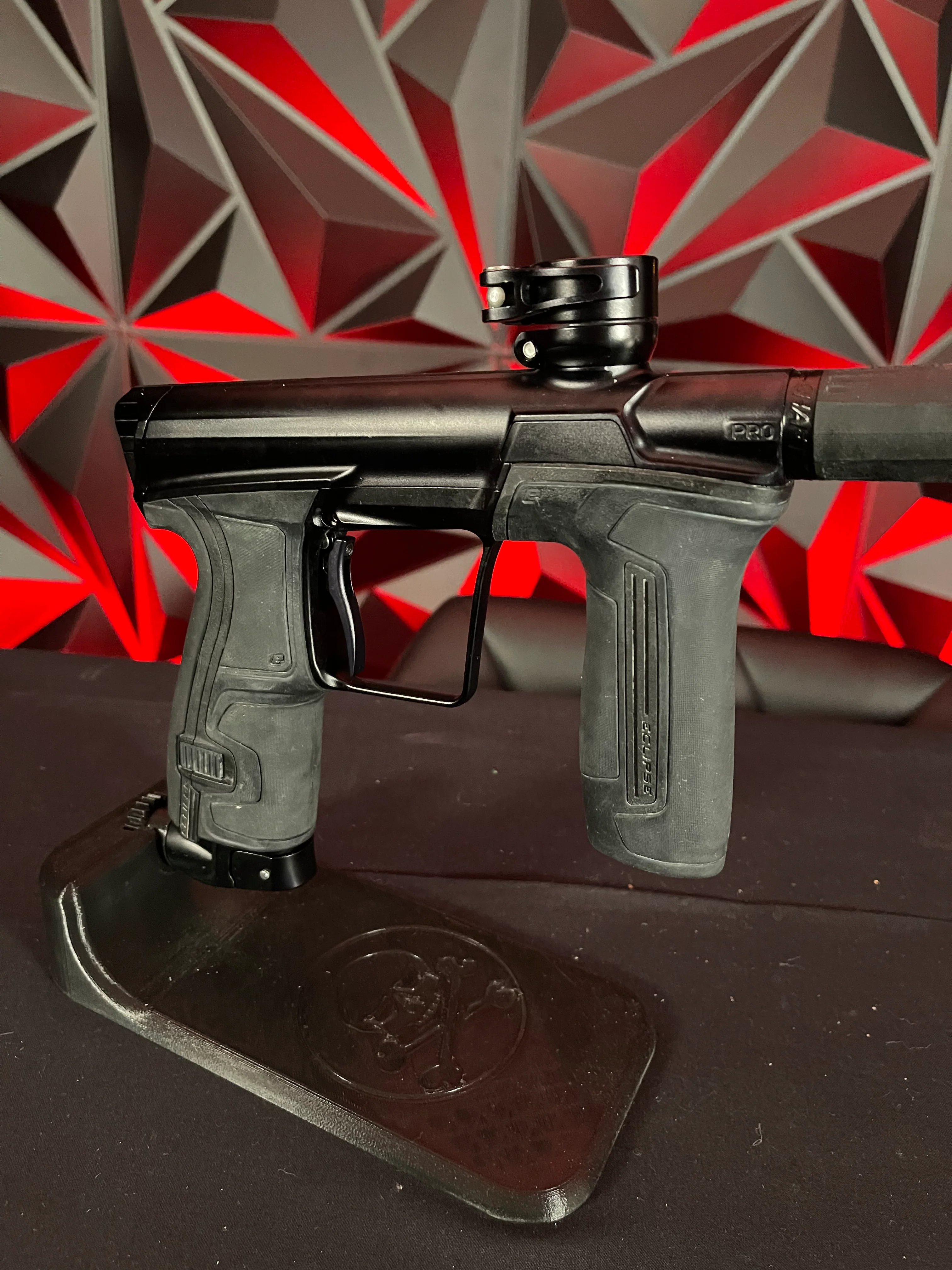Used Planet Eclipse CS2 Pro Paintball Gun - Black w/ Gold Infamous FL Tip, 2 FL Backs, and Spare Black/White Grip Kit - Image 3
