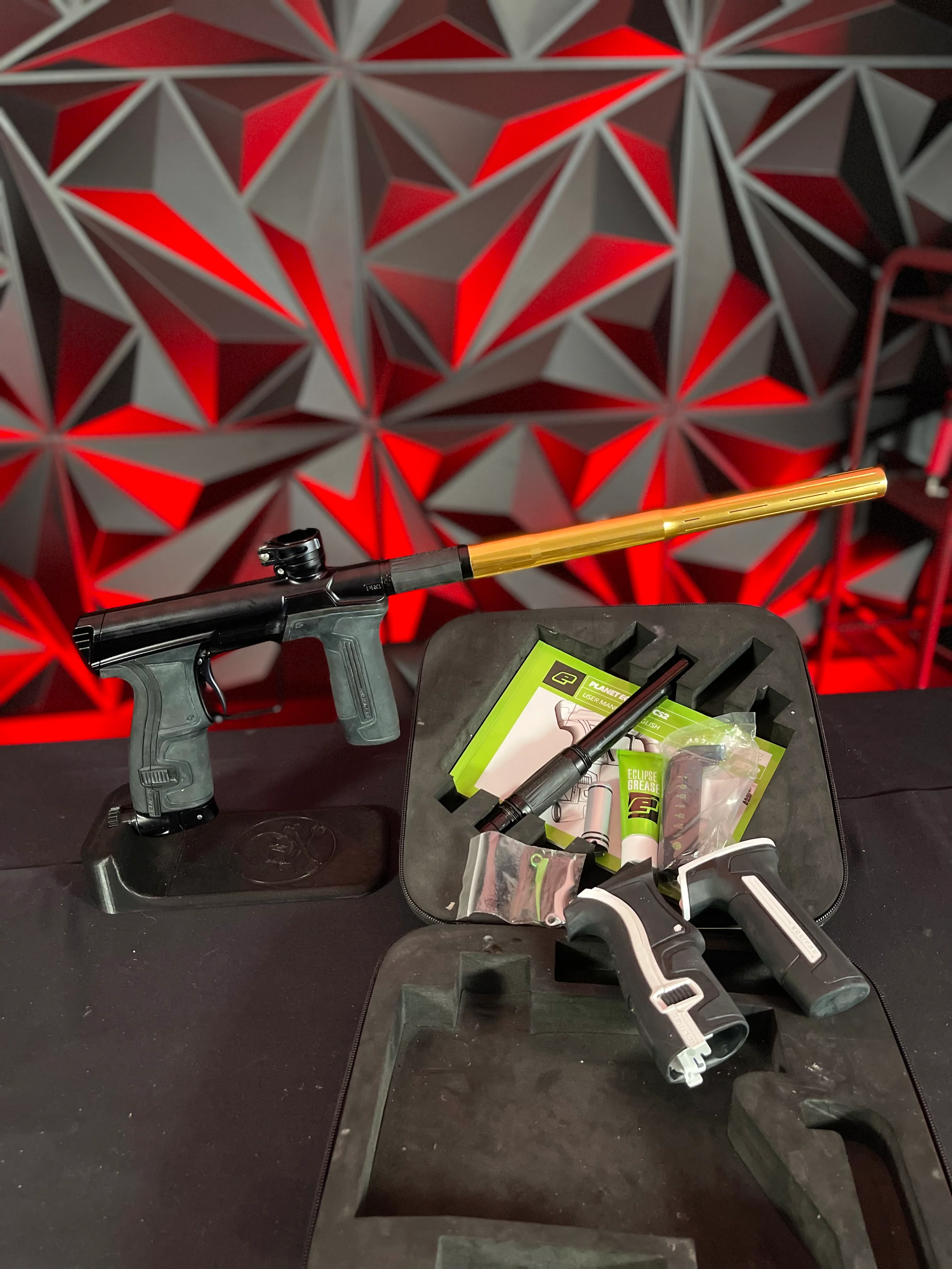 Used Planet Eclipse CS2 Pro Paintball Gun - Black w/ Gold Infamous FL Tip, 2 FL Backs, and Spare Black/White Grip Kit - Image 7