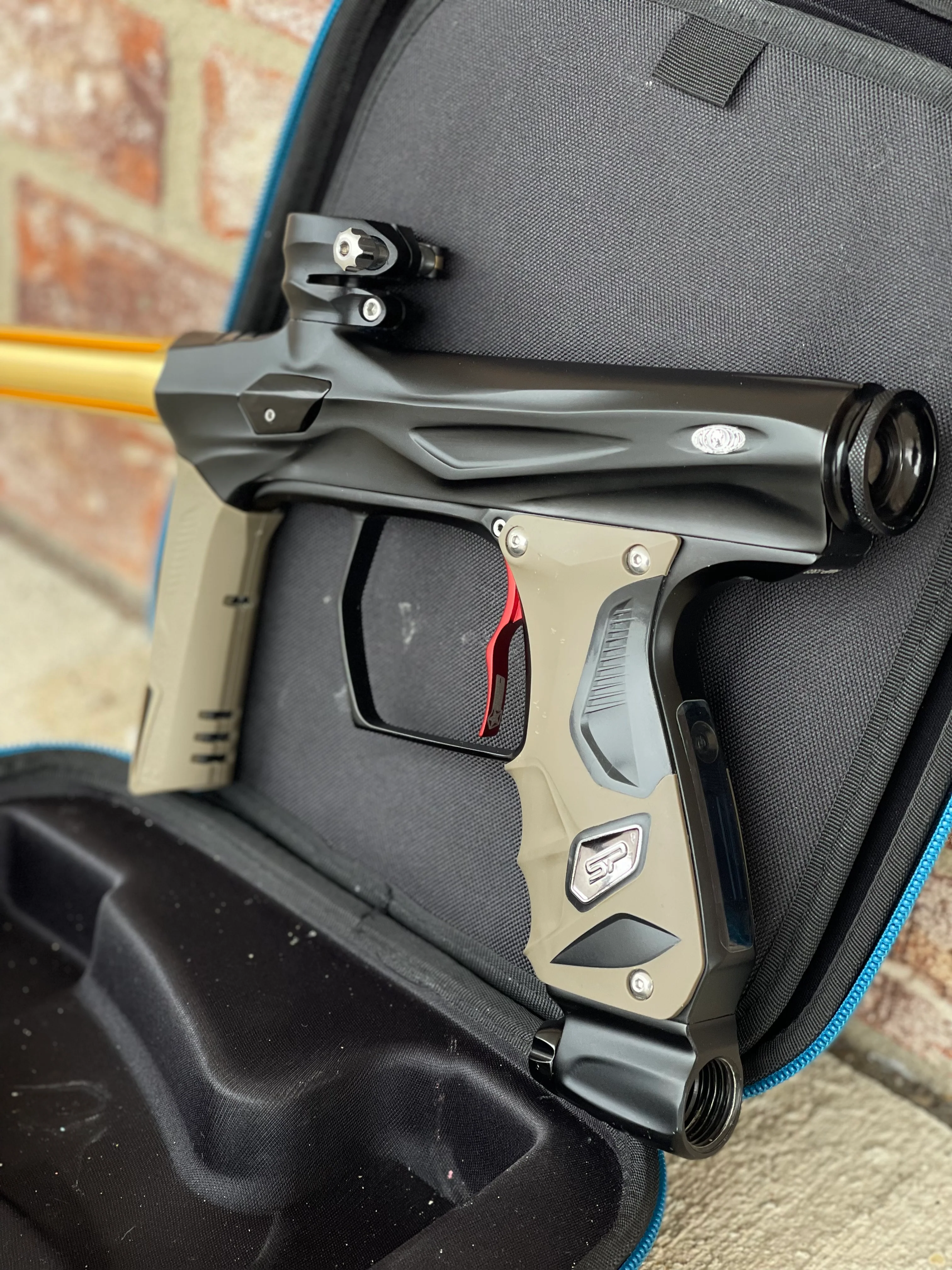 Used Shocker Amp Paintball Gun - Black w/ Red SSC Deuce Trigger and Infamous Red & Gold Silencio FXL Barrel - Image 2