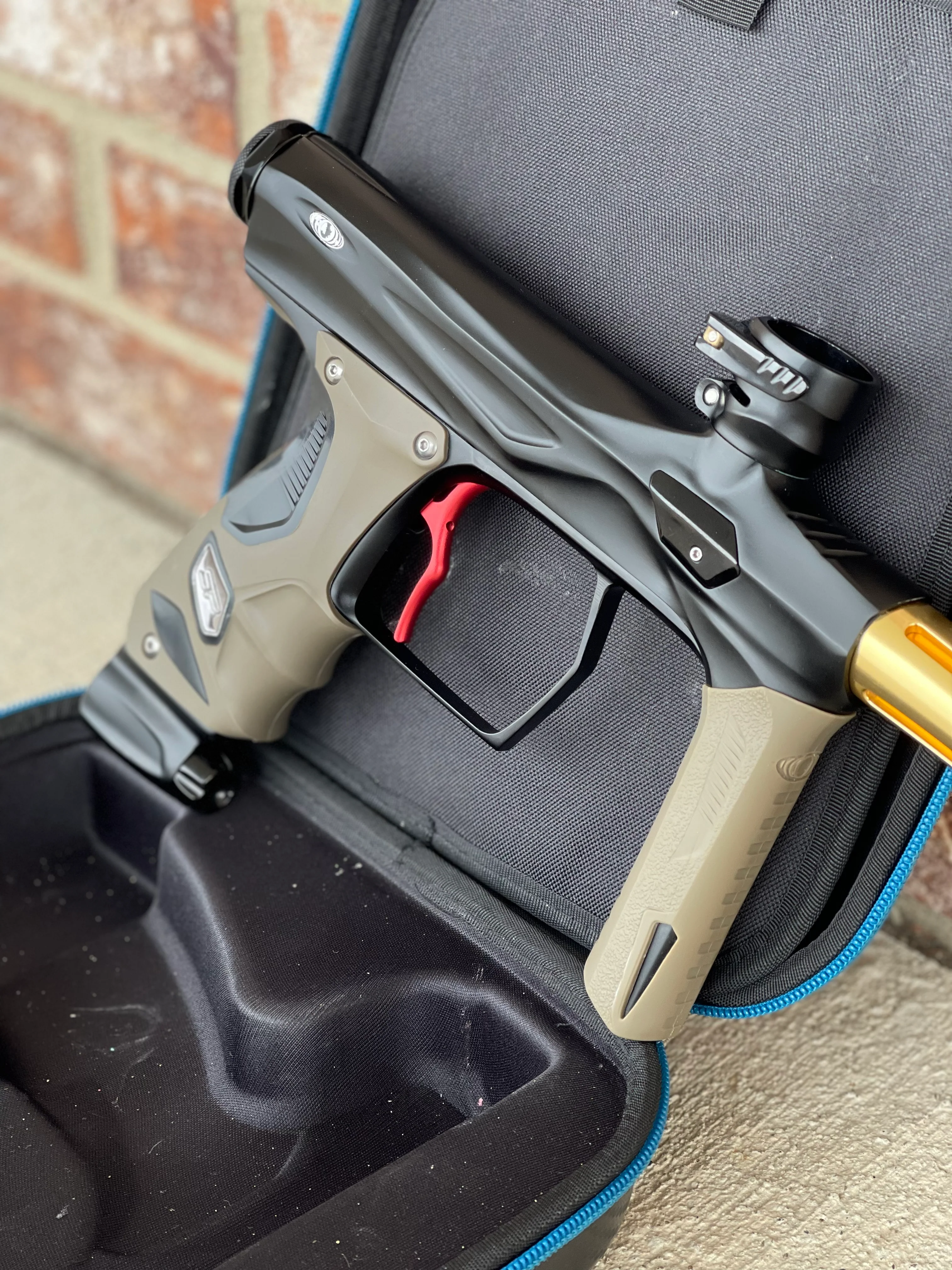 Used Shocker Amp Paintball Gun - Black w/ Red SSC Deuce Trigger and Infamous Red & Gold Silencio FXL Barrel - Image 3