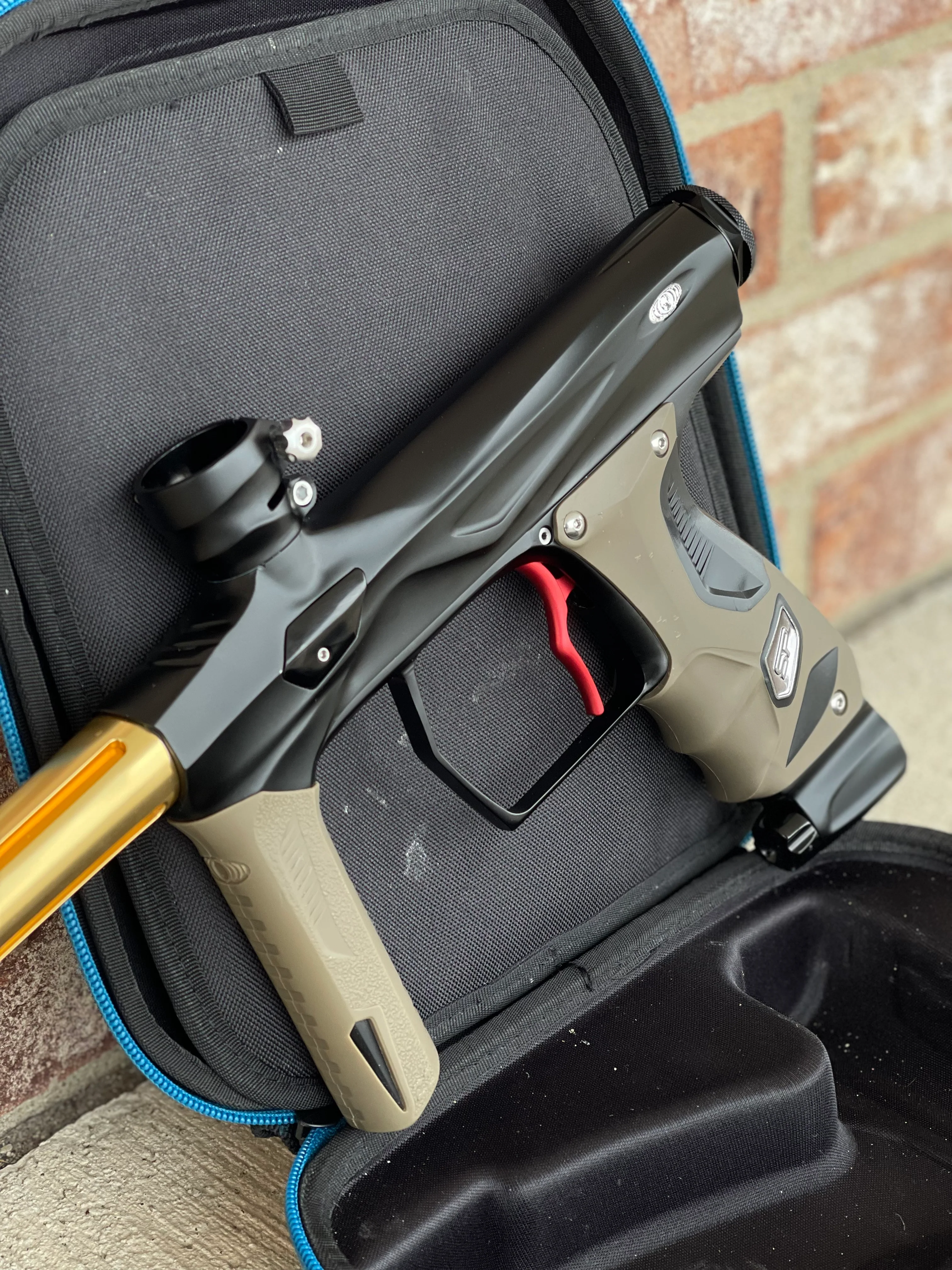 Used Shocker Amp Paintball Gun - Black w/ Red SSC Deuce Trigger and Infamous Red & Gold Silencio FXL Barrel - Image 4