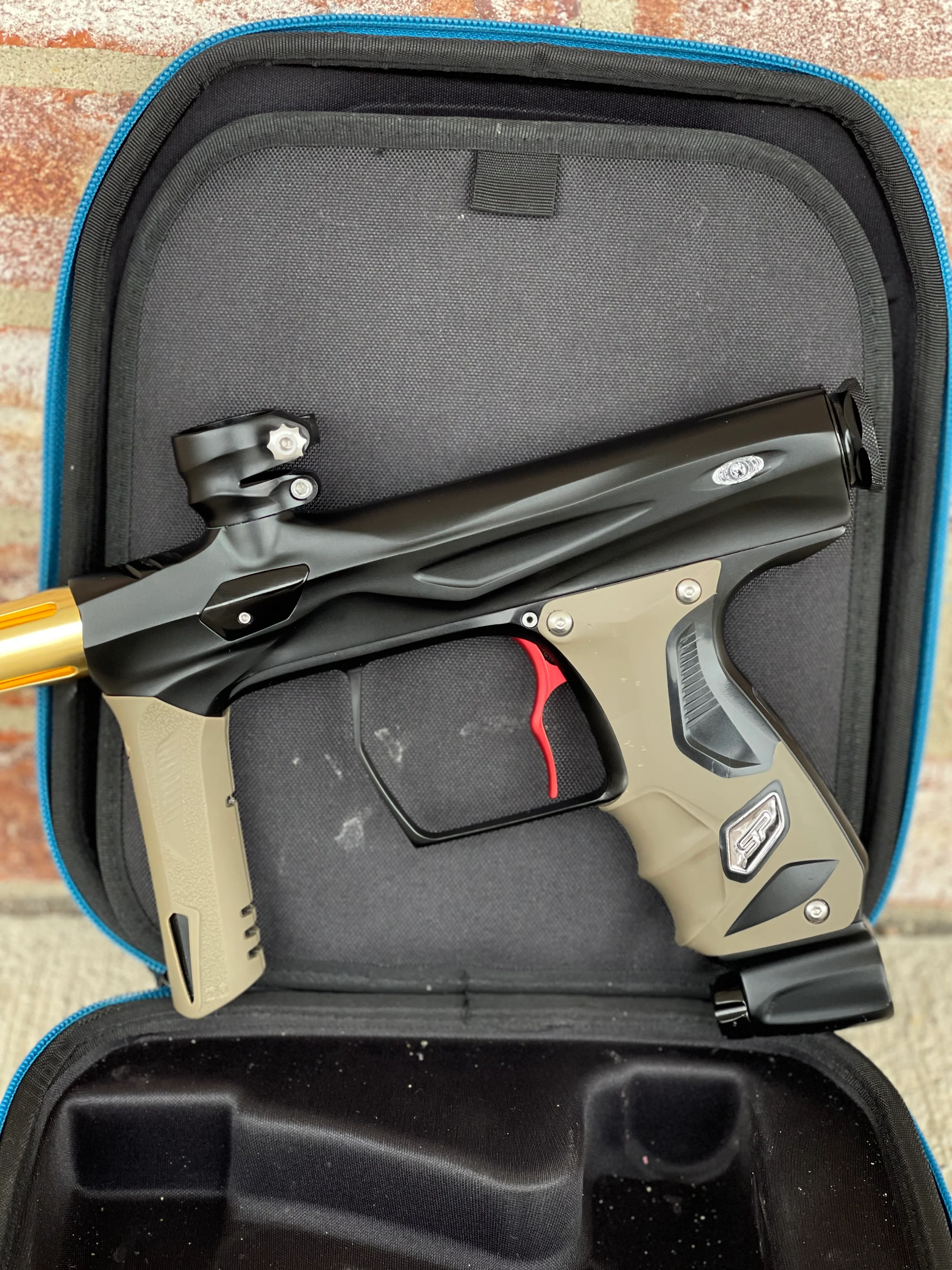 Used Shocker Amp Paintball Gun - Black w/ Red SSC Deuce Trigger and Infamous Red & Gold Silencio FXL Barrel - Image 6