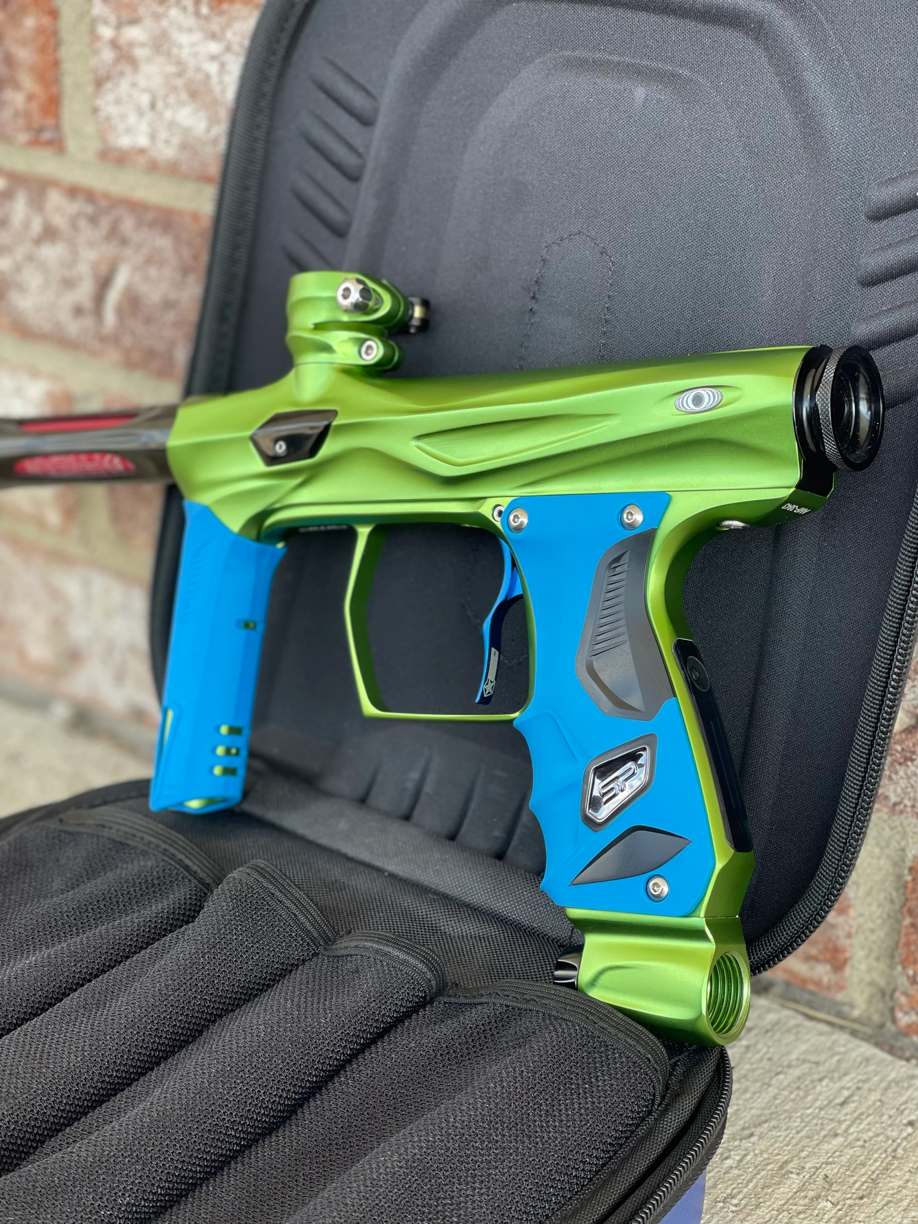 Used Shocker Amp Paintball Gun - Green/Black with Infamous Deuce Trigger and Blue Grips - Image 2