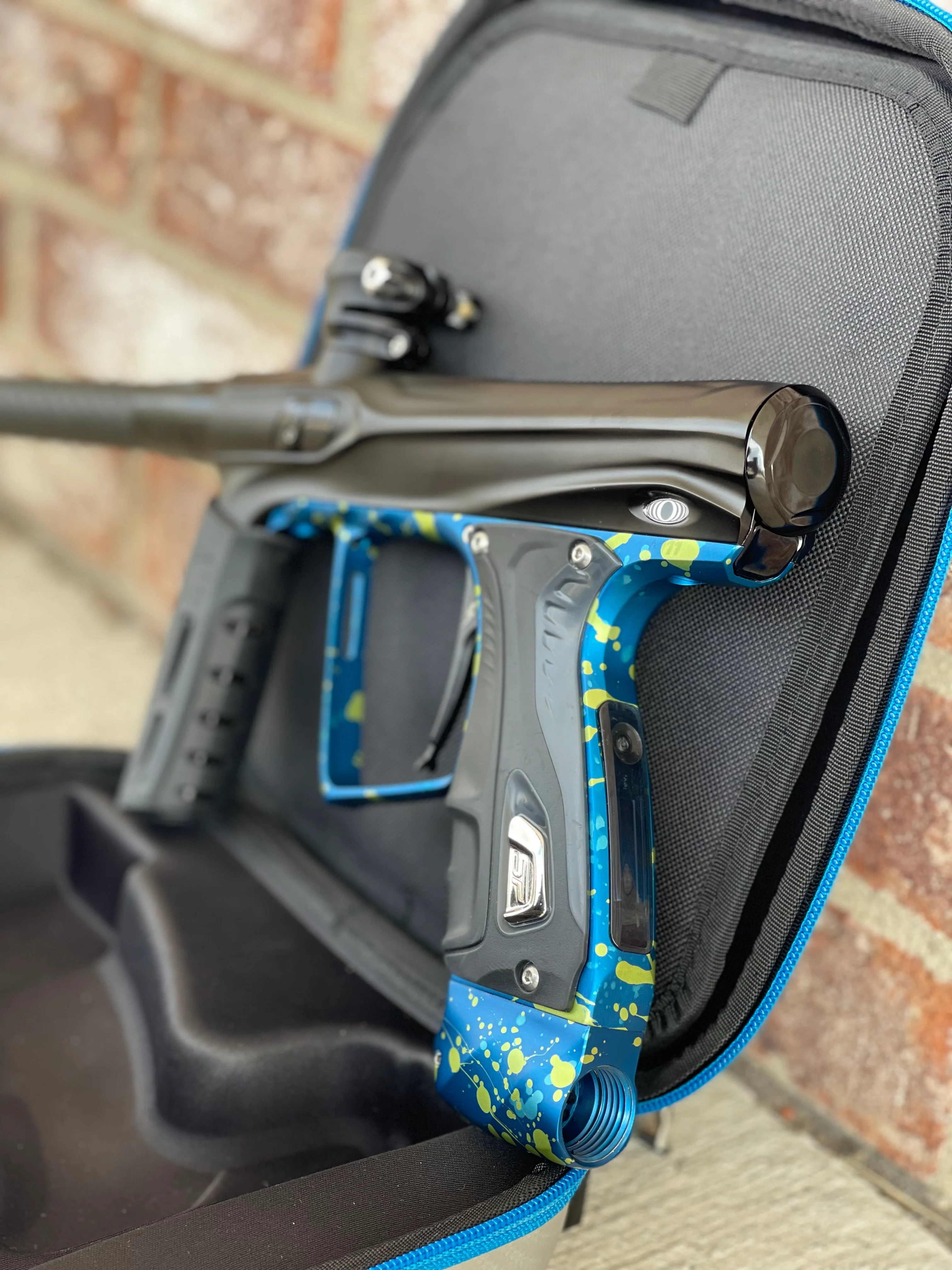 Used Shocker XLS Paintball Gun - Black with Blue Green Splash Trigger Frame and CVO Frame - Image 2